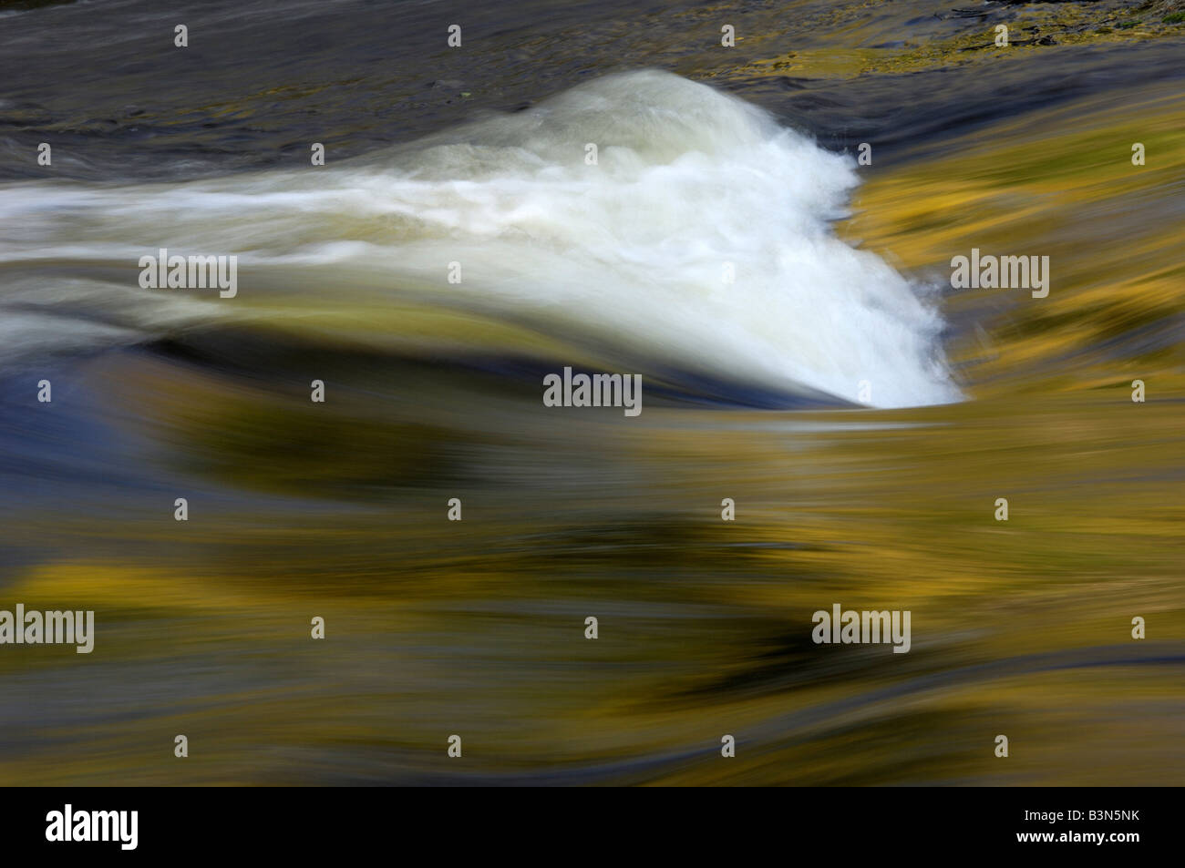 Autumn colours reflected in rapids along the Frost River, Minnesota, USA Stock Photo