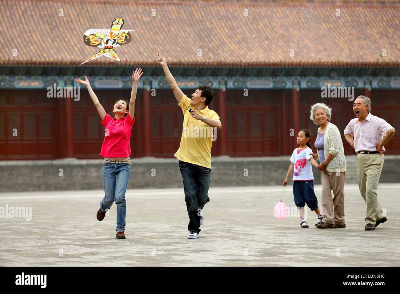 chinese families flying kites in the forbidden city,beijing,china Stock Photo