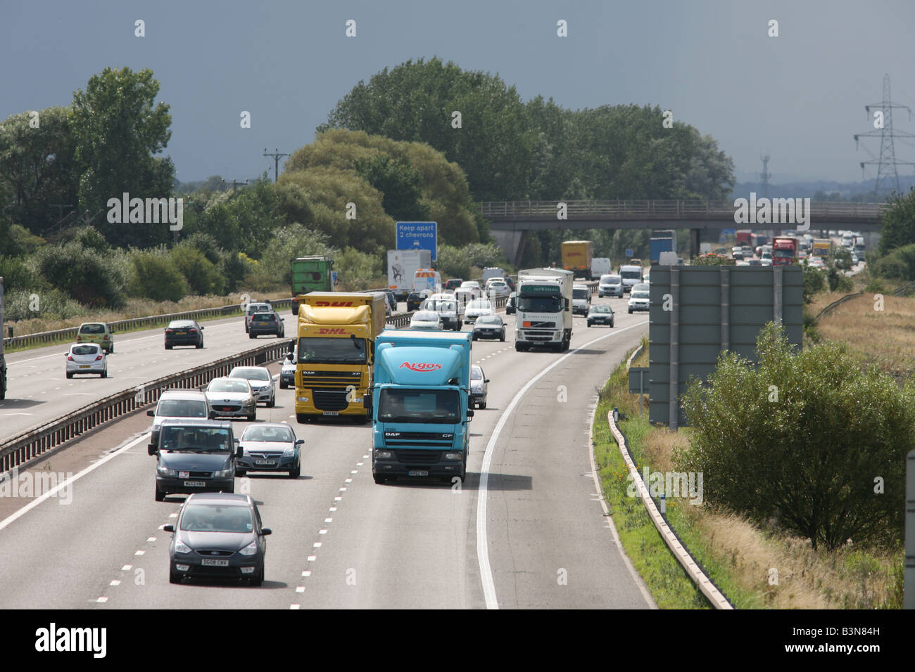 HGVs and cars traveling on M56 motorway, Cheshire,UK,EU Stock Photo