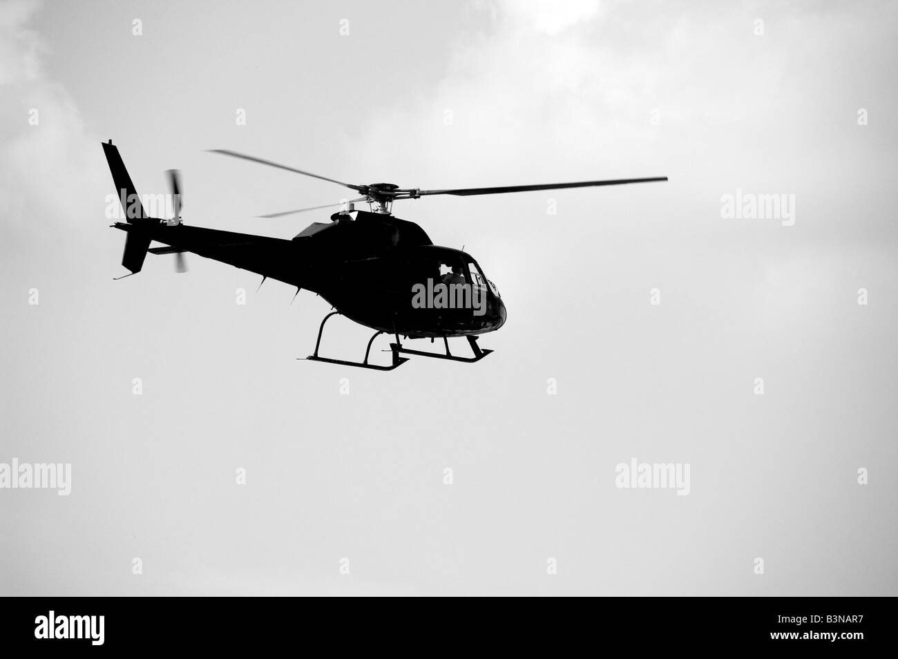 Helicopter in flight, black & white Stock Photo