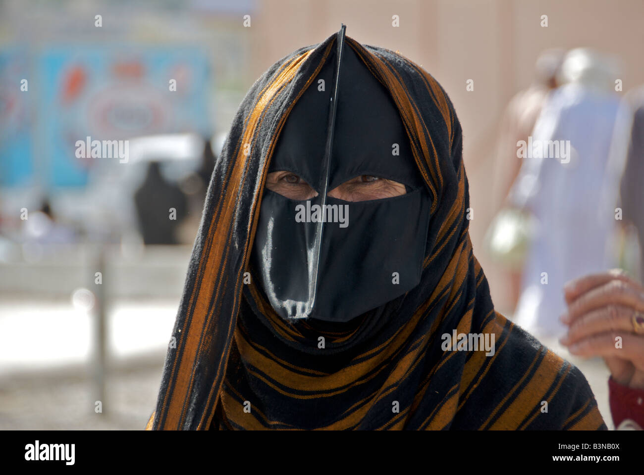 Close up Bedouin woman wearing black burka Nizwa Al Dakhiliyah Region Sultanate of Oman Stock Photo
