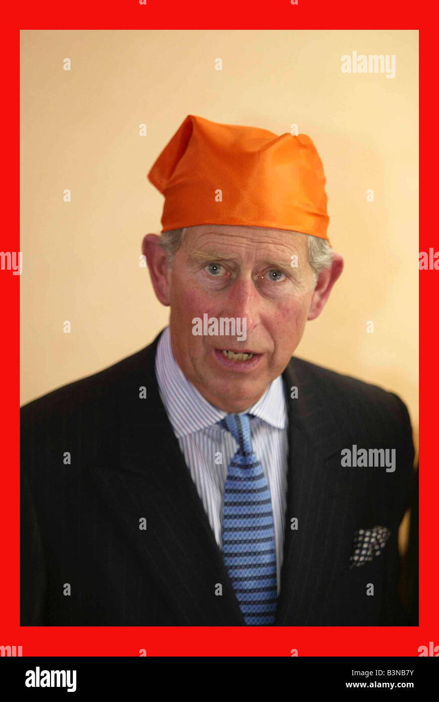 Prince Charles June 2003 Visits Gurdxwara Sri Guru Singh Sabha Temple Southall hat headgear funny expression humour orange suit Stock Photo