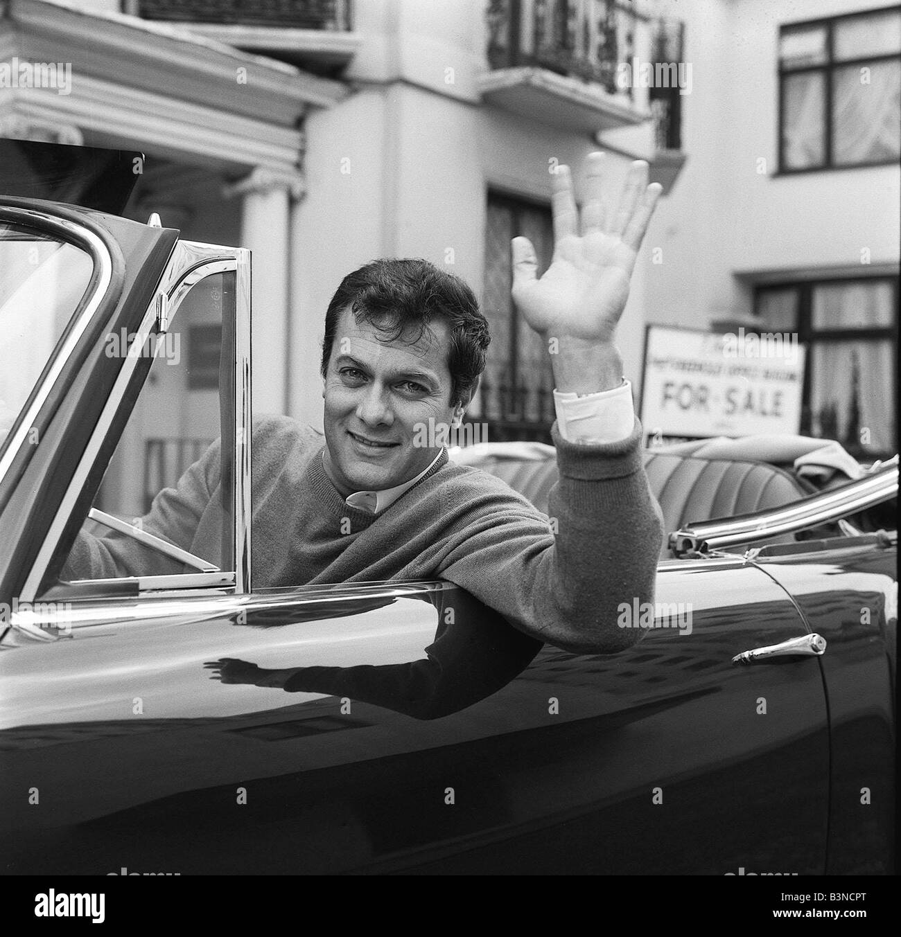 Tony Curtis, american actor poses for pictures in his Alvis TE21 motorcar in Knightsbridge, London, Thursday 2nd September 1965. Stock Photo