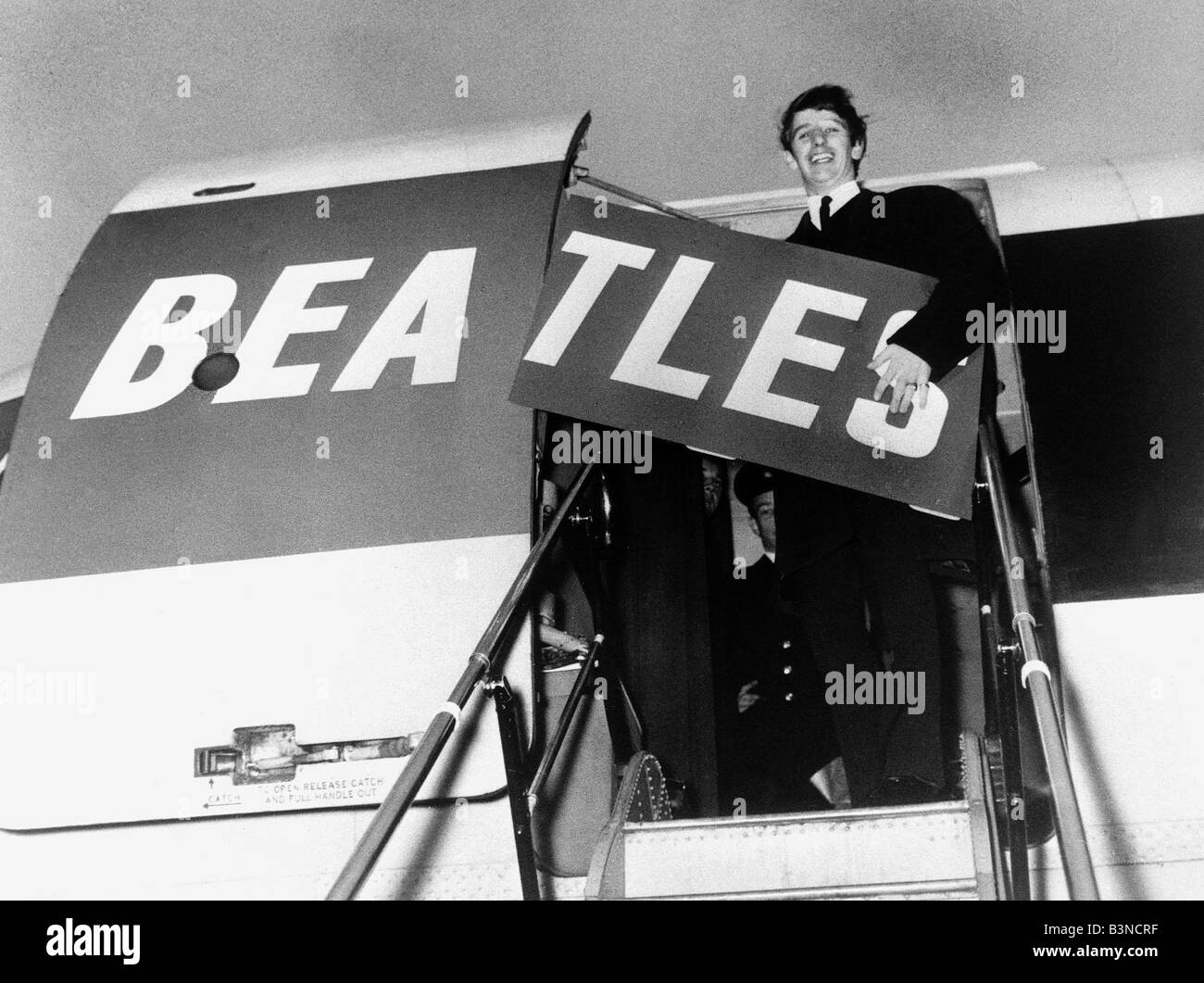 The Beatles Ringo Starr Jan 1964 Holds Up A Board With The Letters Tles As He Boards A Plane To Spell Beatles Stock Photo Alamy
