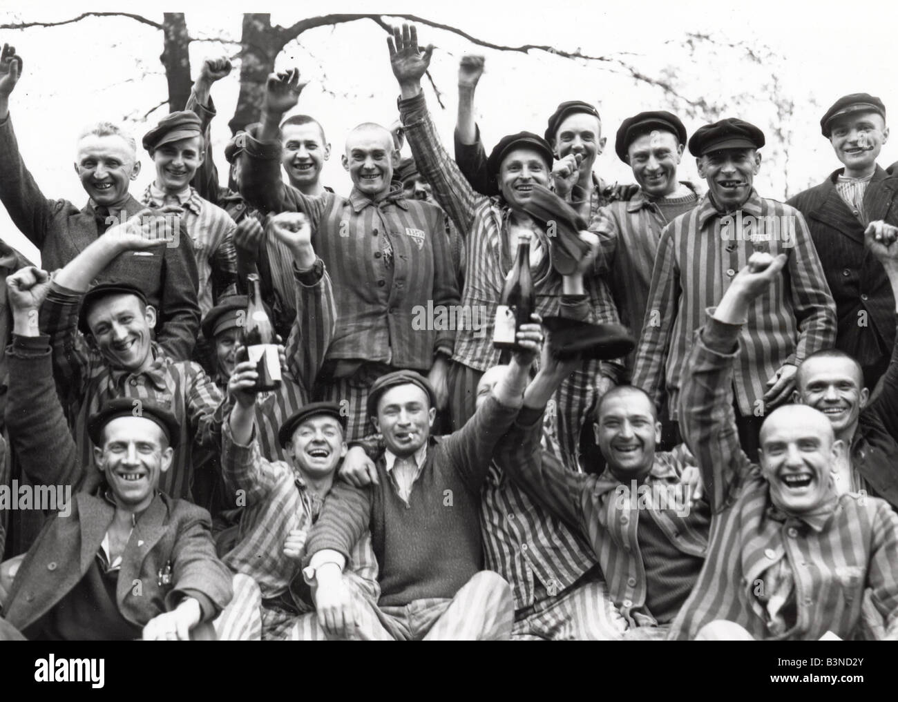 DACHAU Prisoners celebrate the liberation of the Nazi concentration camp near Munich in April 1945 Stock Photo