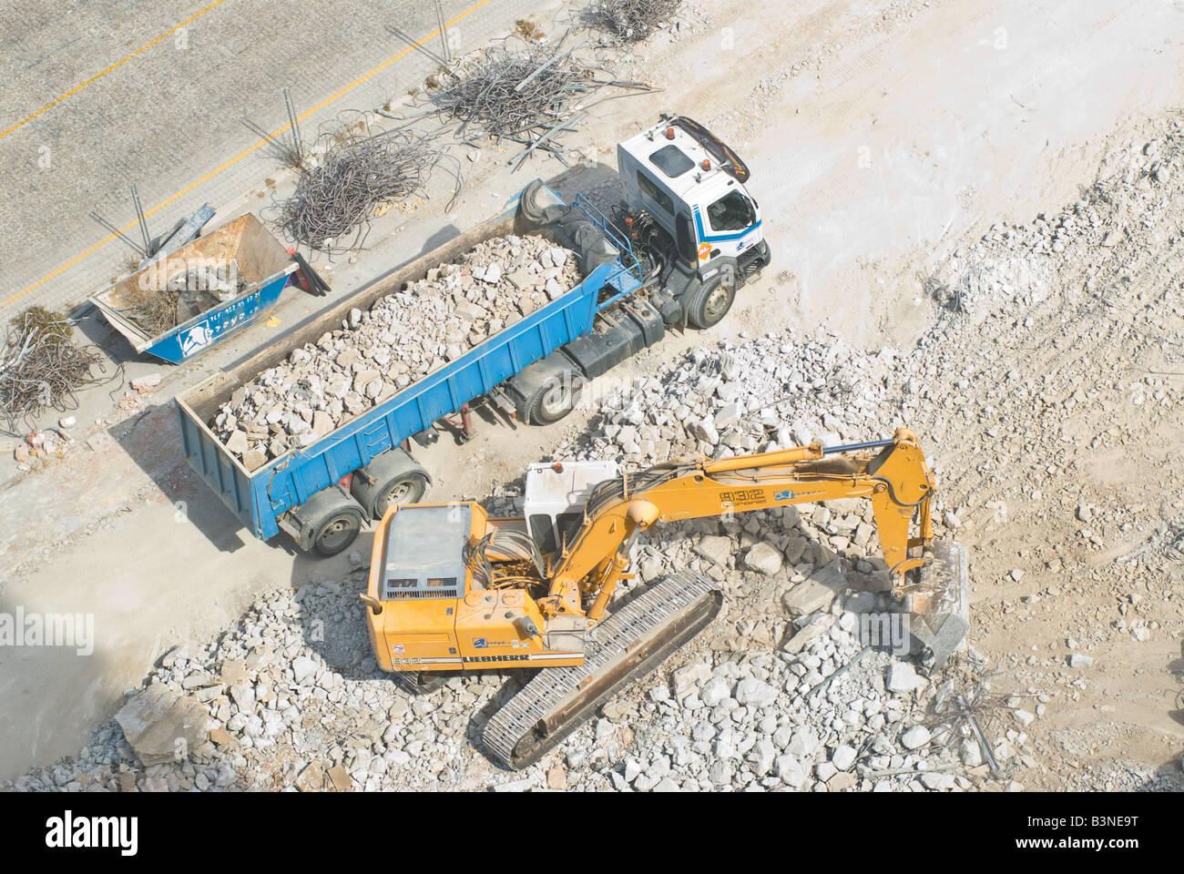 crawler bucket excavator loading semi-trailer truck Stock Photo