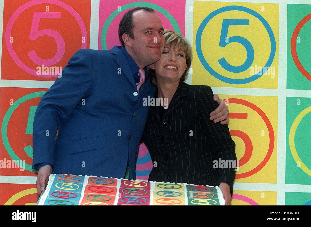 Jack Docherty TV Presenter Kirsty Young March 1998 Newsreader and Presenter hug each other first birthday party of Channel 5 TV Stock Photo