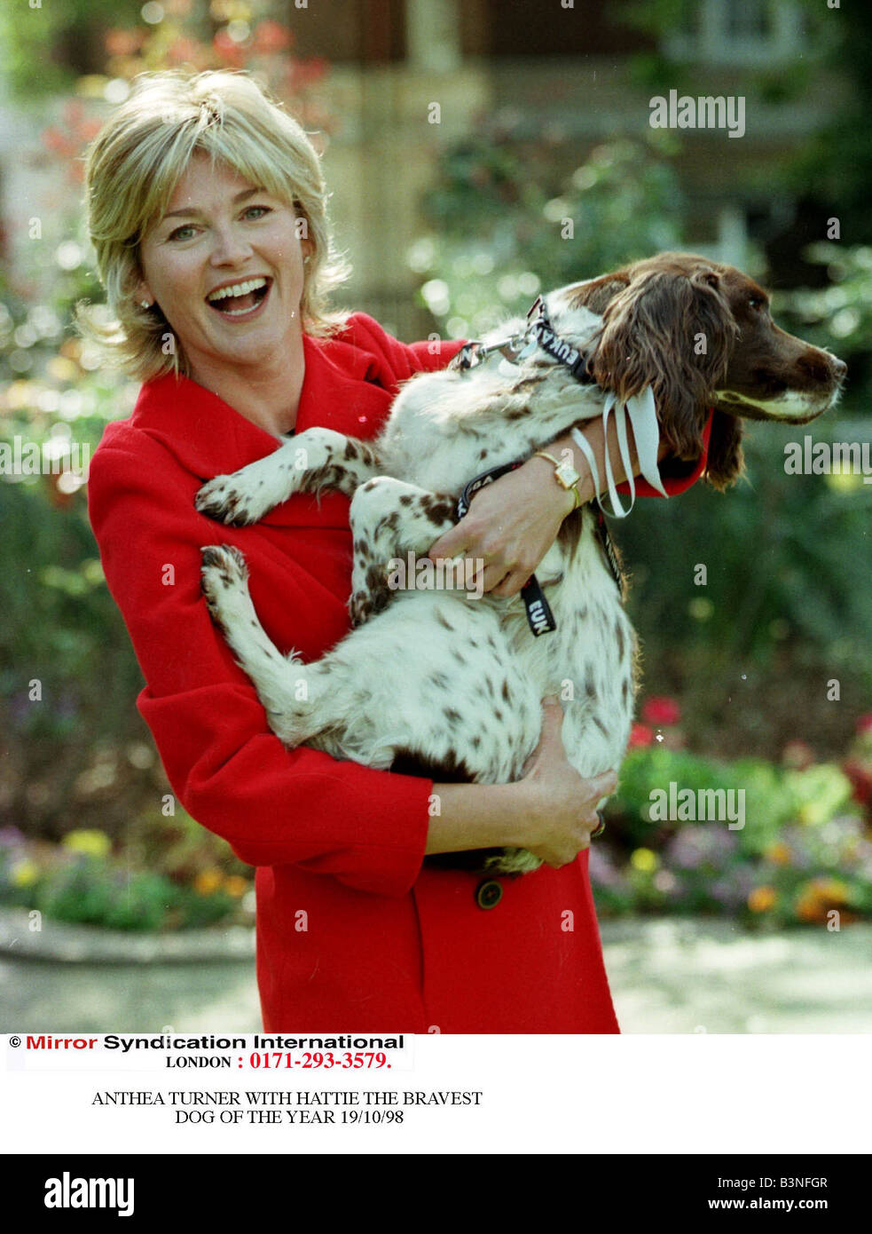Anthea Turner TV Presenter with Hattie October 1998 Television Presenter Anthea Turner is pictured holding Hattie the Dog winner at the Bravest Dog of the Year Awards Stock Photo