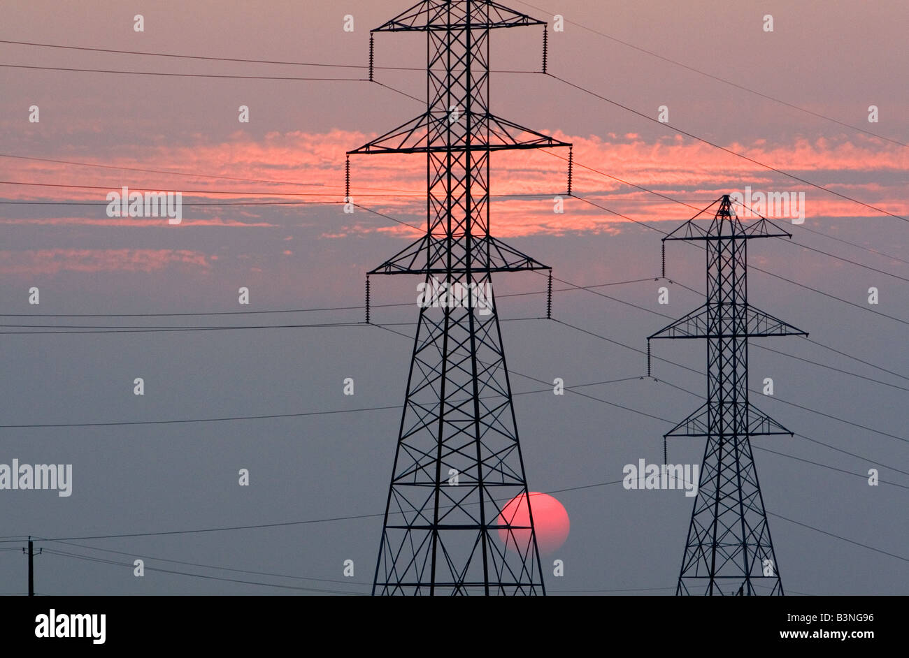 High voltage electric transmission lines at sunset in Boise Idaho Stock Photo