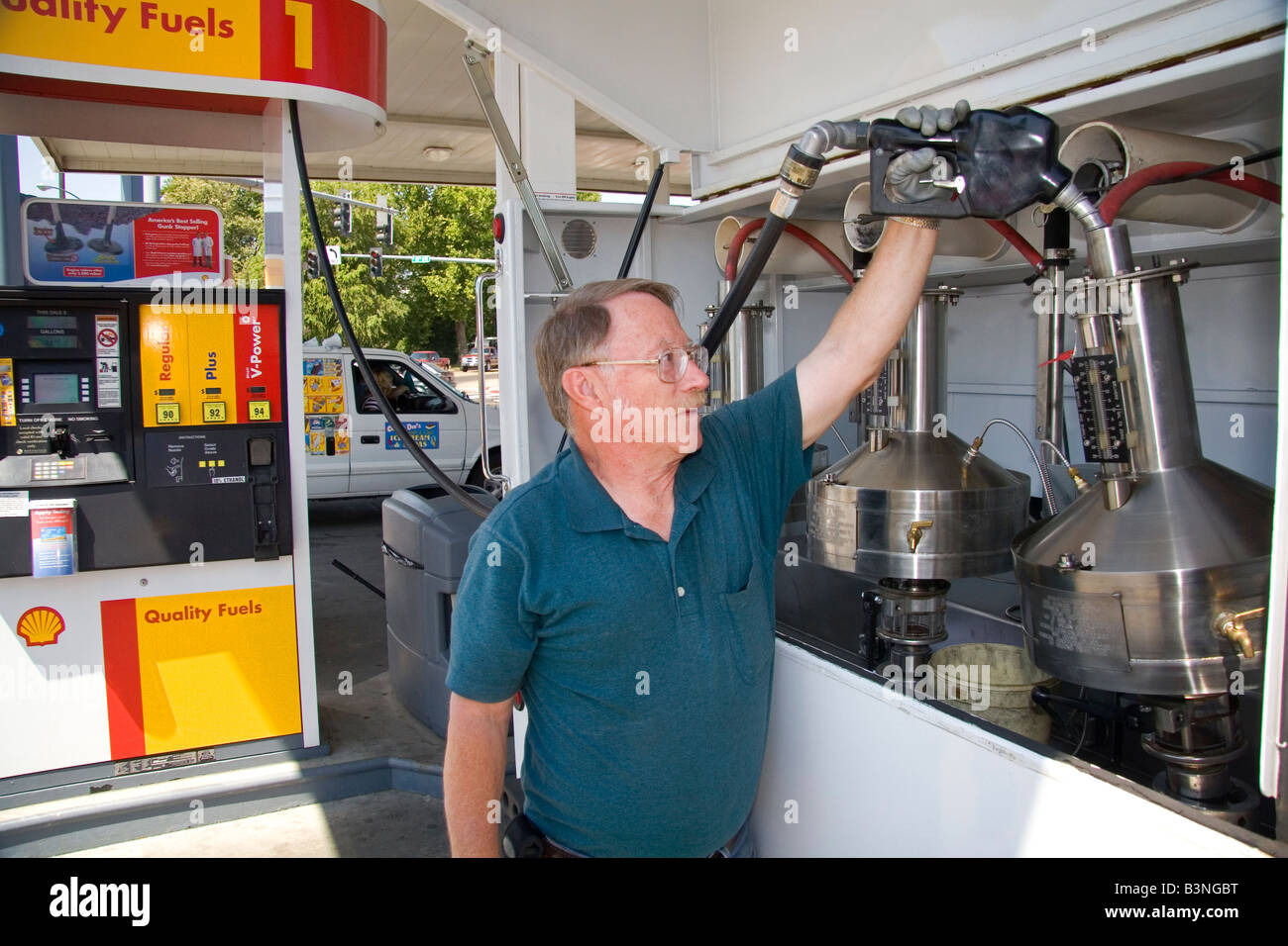 Bureau of Weights and Measures inspector testing gasoline octane rating