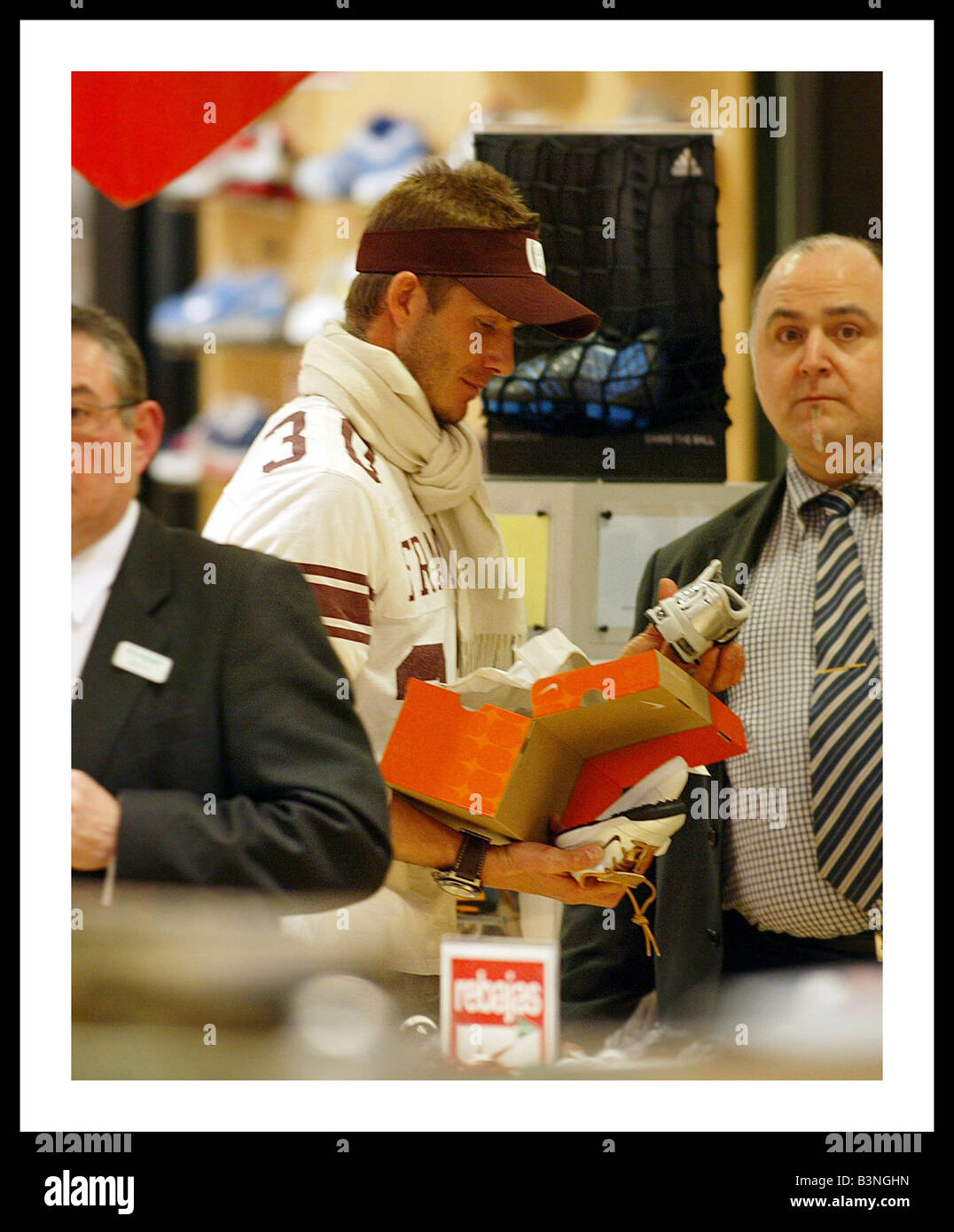 David Beckham looking at Nike trainers in the sale for his sons El Cort Ingles store Madrid February 2005 Photo -