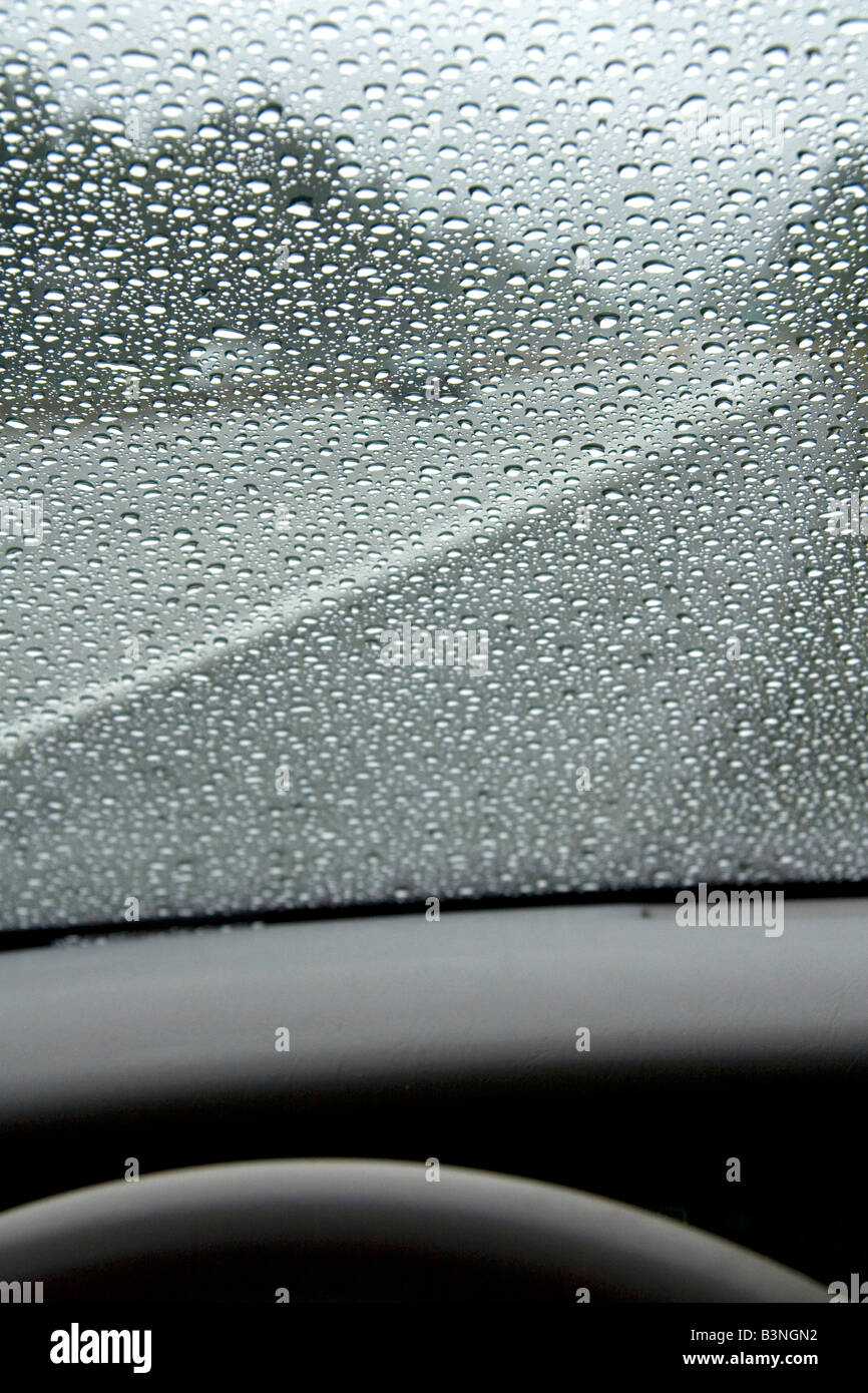 Raindrops on the windshield of a car in Washington Stock Photo