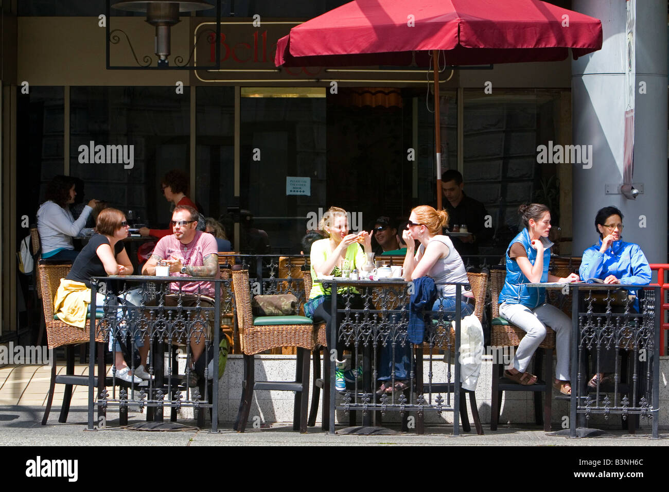People dine at a sidewalk cafe in Vancouver British Columbia Canada Stock Photo