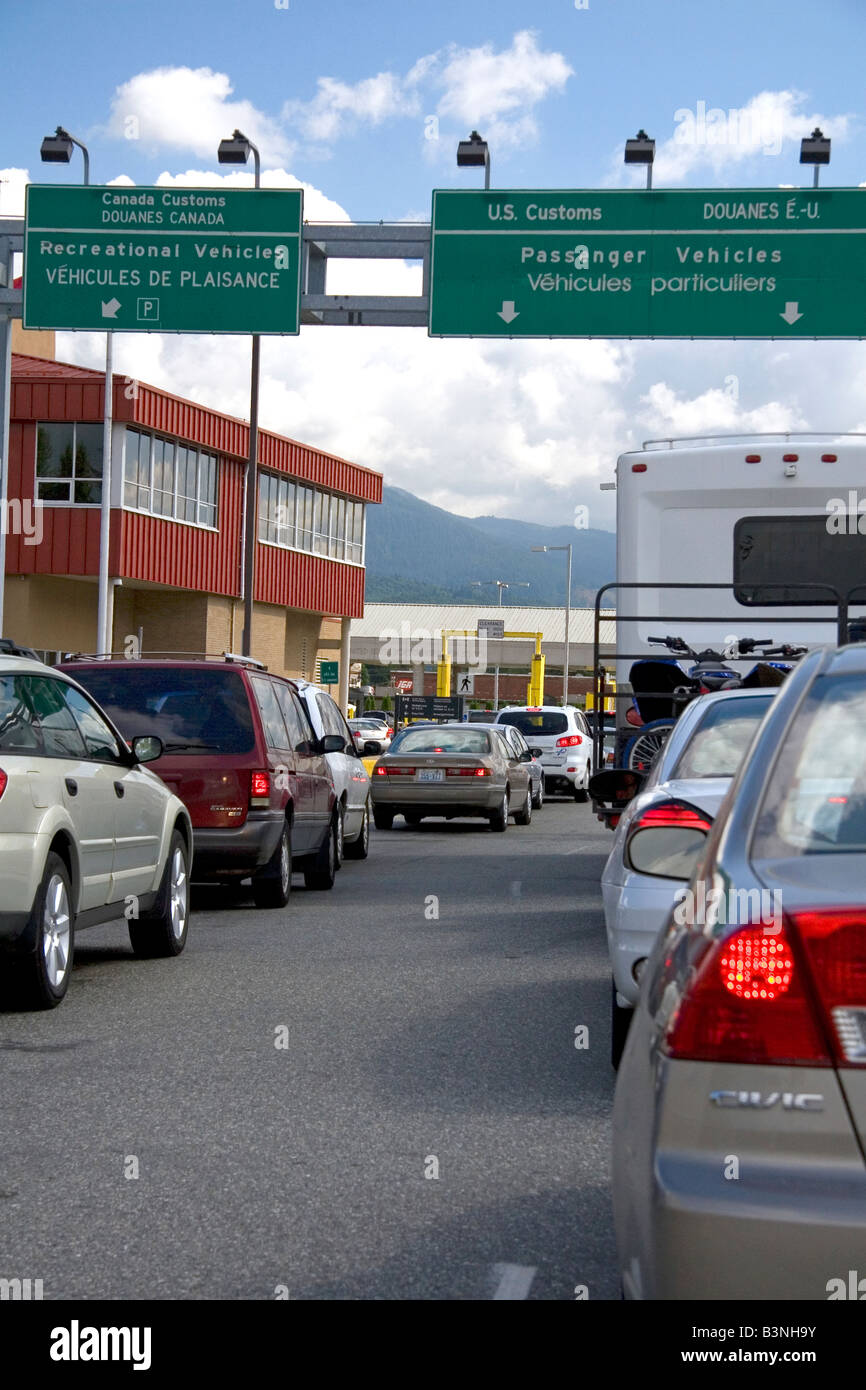 Cars waiting to enter the United States at the Canadian port of entry in Abbotsford British Columbia Stock Photo