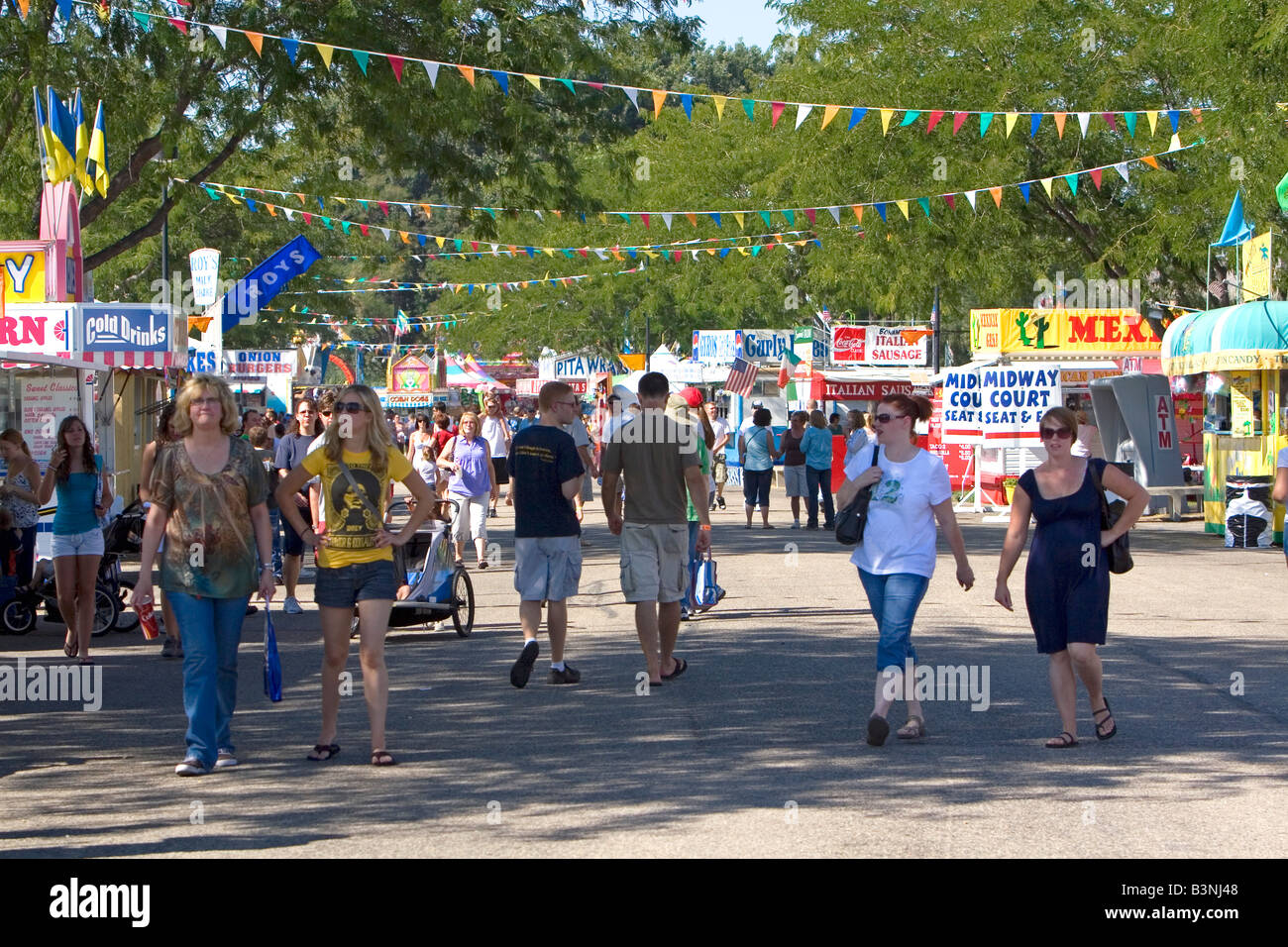 People walk amongst food stands at the Western Idaho Fair in Boise Idaho Stock Photo