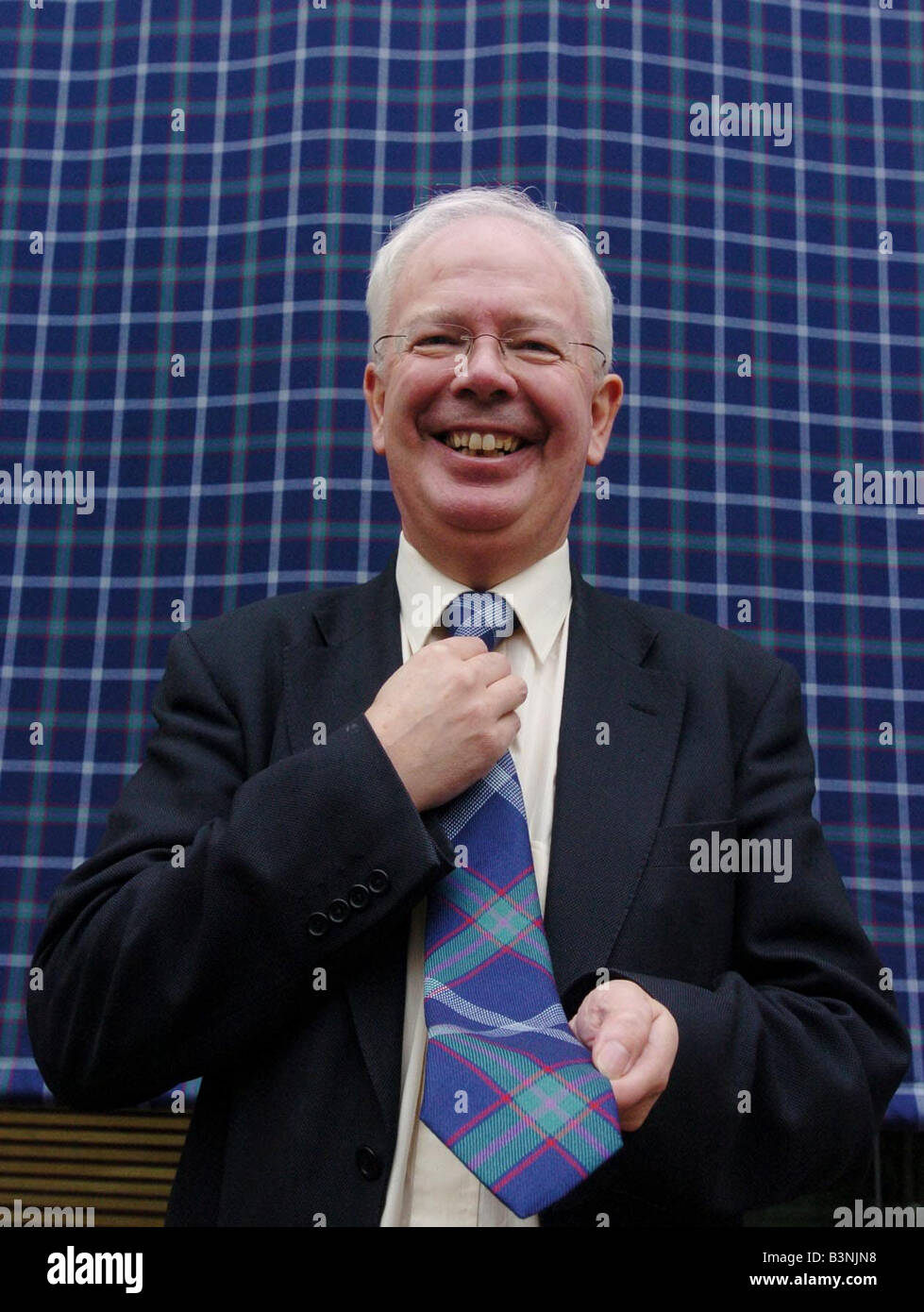 Deputy first minister Jim Wallace unveils G8 tartan in March 2005 Stock