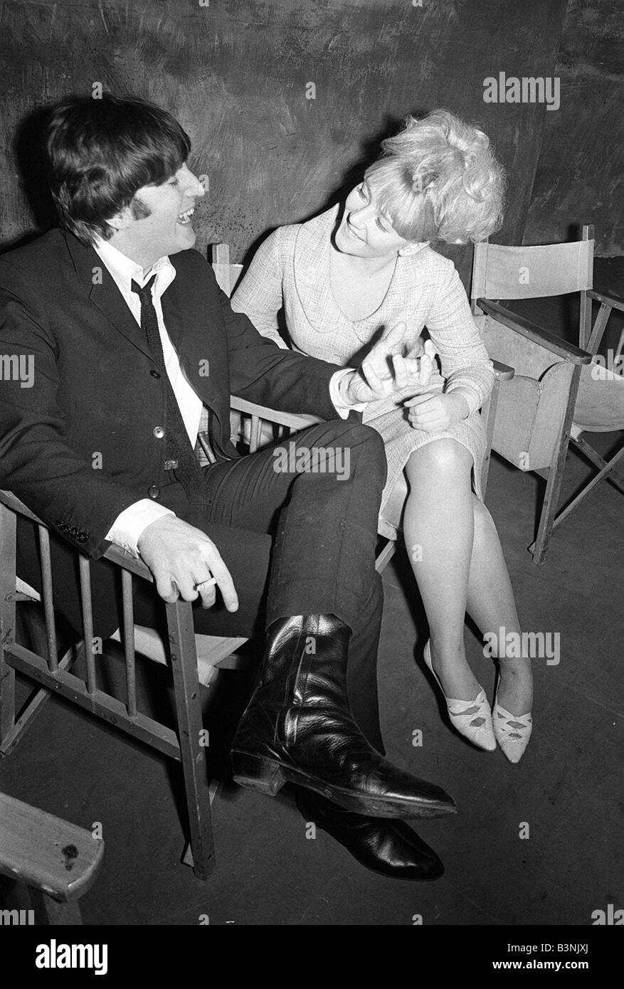 The Beatles on film set for a Hard Days Night John lennon talking to a girl on set 1964 Stock Photo