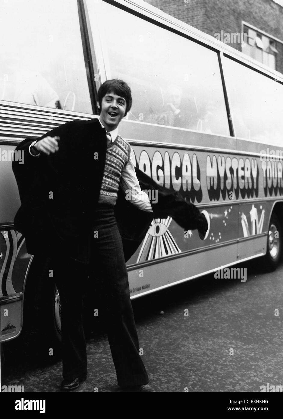 Beatles Paul McCartney standing by the coach used in their Magical Mystery Tour September 1967 Stock Photo