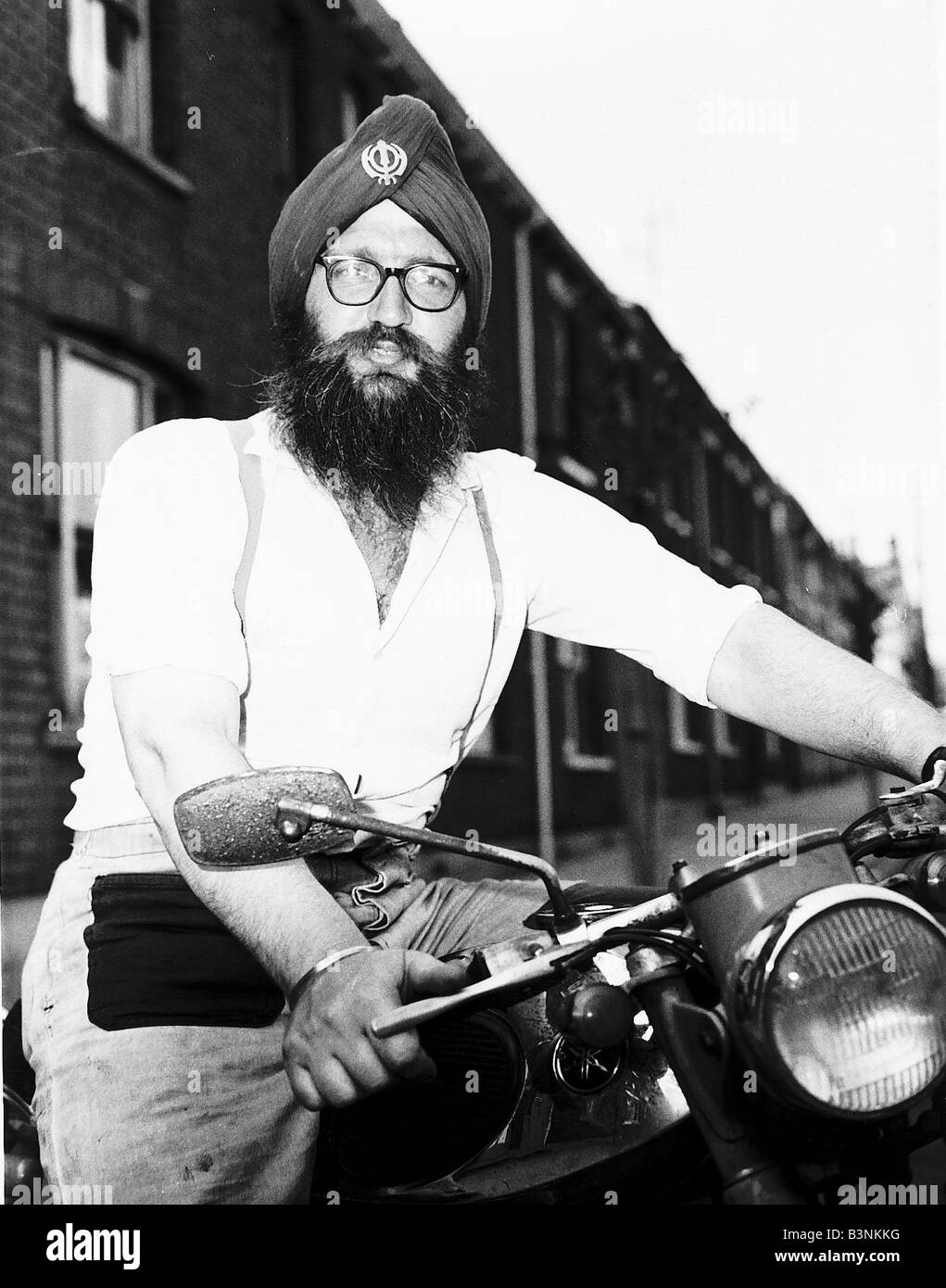Hans Powles was arrested again for not wearing a motorcycle helmet when riding his bike after it was made law He was fined 1 each time he was not wearing one at court his Sikh name is Mohan Hartung Singh Stock Photo