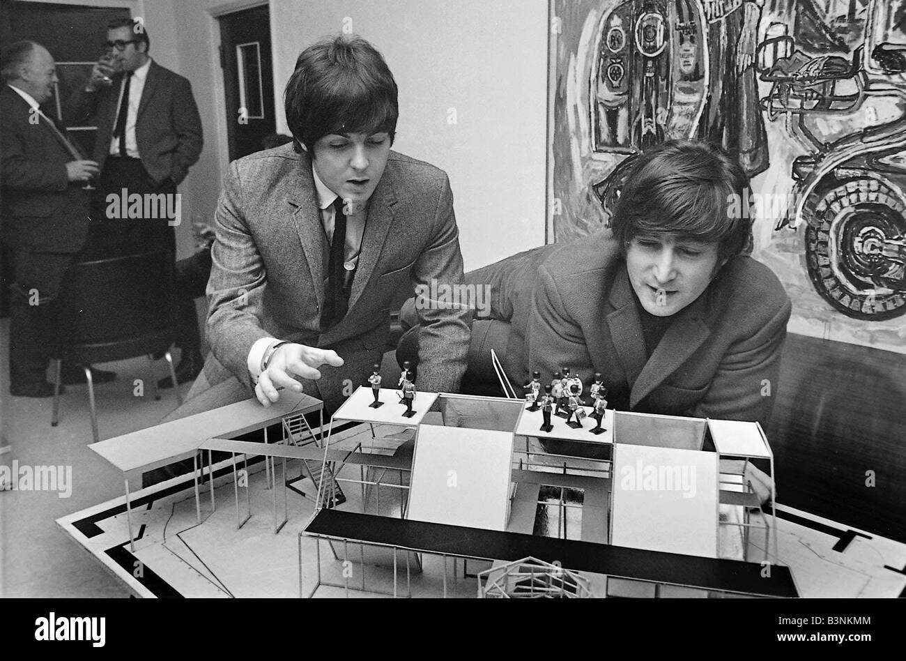 John Lennon and Paul McCartney talk tactics as toy soldiers double as real life Beatles on Johnny Hamps scale model of The Music Of Lennon and McCartney stage set 1965 Stock Photo