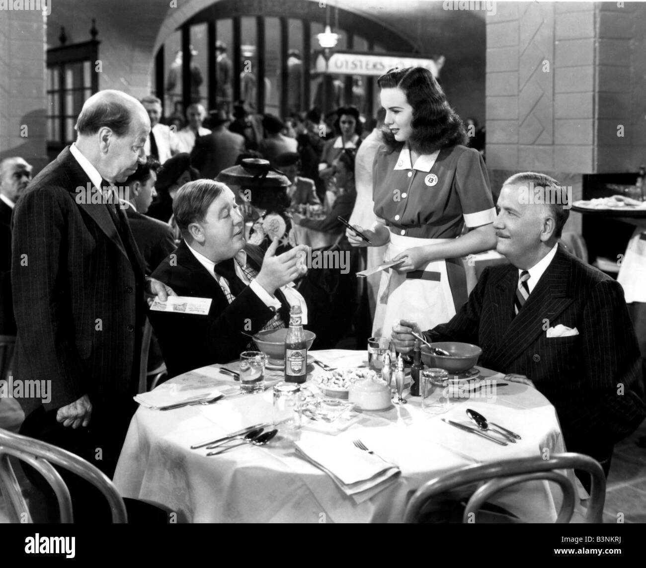 BECAUSE OF HIM  1945 Universal film with Deanna Durbin and Charles Lughton seated at left Stock Photo