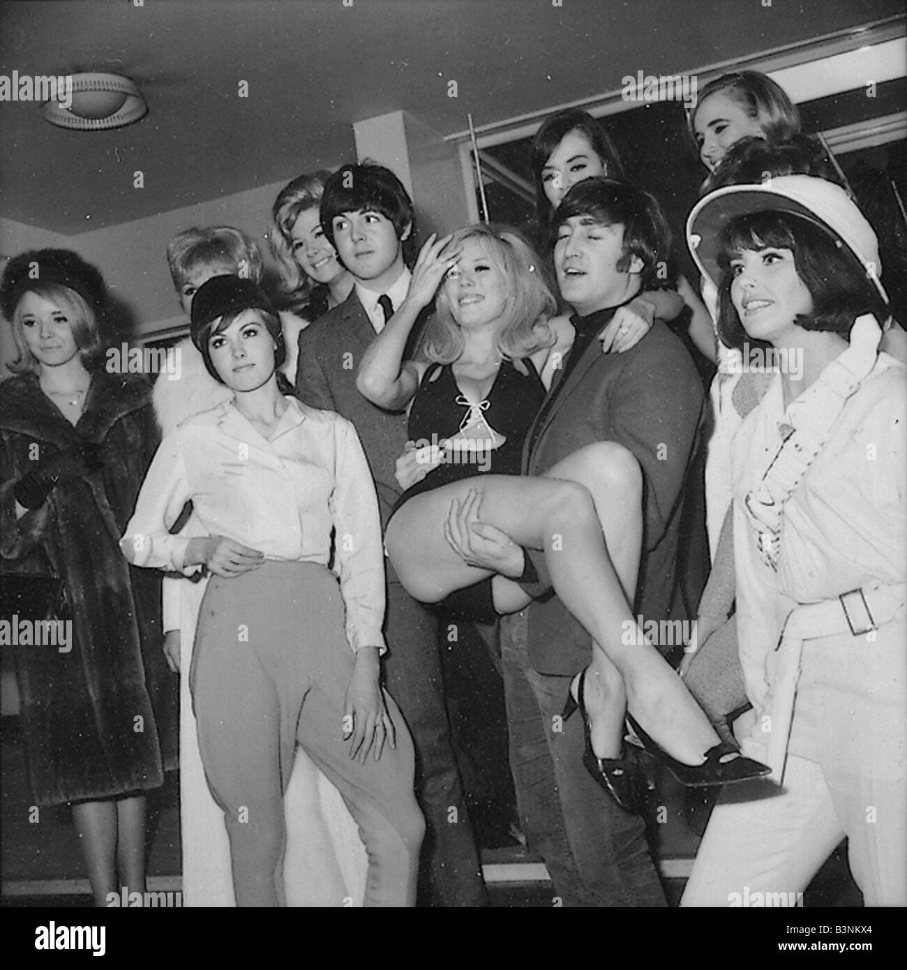 Beatles files 1965 John Lennon with showgirls before rehearsals for the