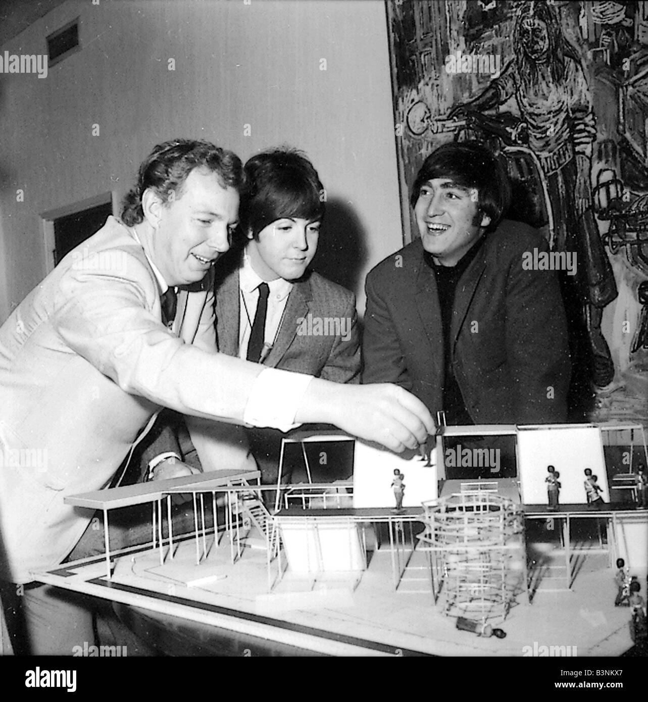 Beatles files 1965 John Lennon Paul McCartney is shown on the stage set of a new show with toy soldiers to aid with designer Stock Photo