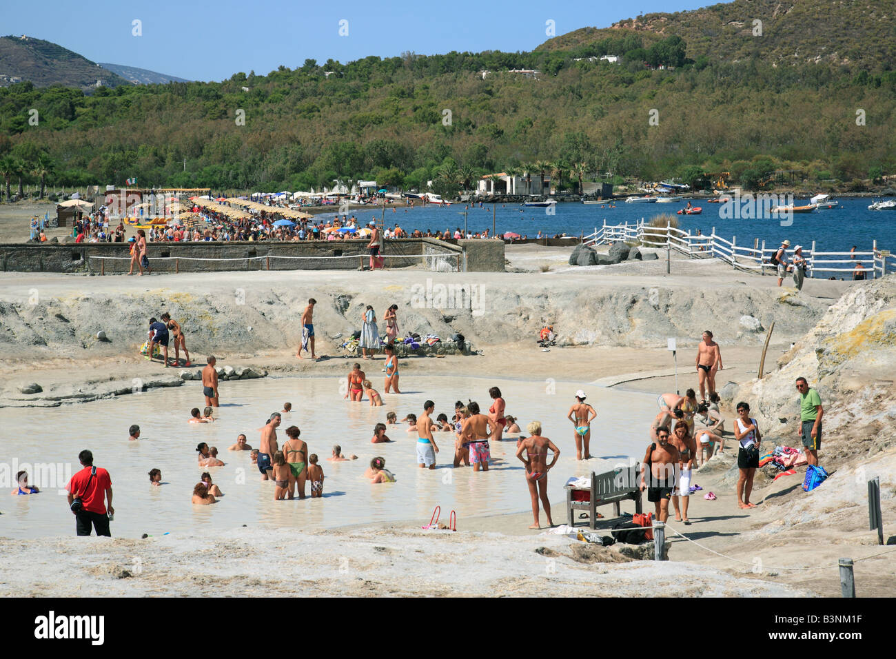 Italy, Sicily, Province of Messina, Aeolian Islands, Lipari Islands, Tyrrhenian Sea, Mediterranian Sea, Vulcano Island, volcanic island, Porto di Levante, tourists taking a sulfur mud bath in a hot spring, therapy against skin diseases, rheumatism and art Stock Photo