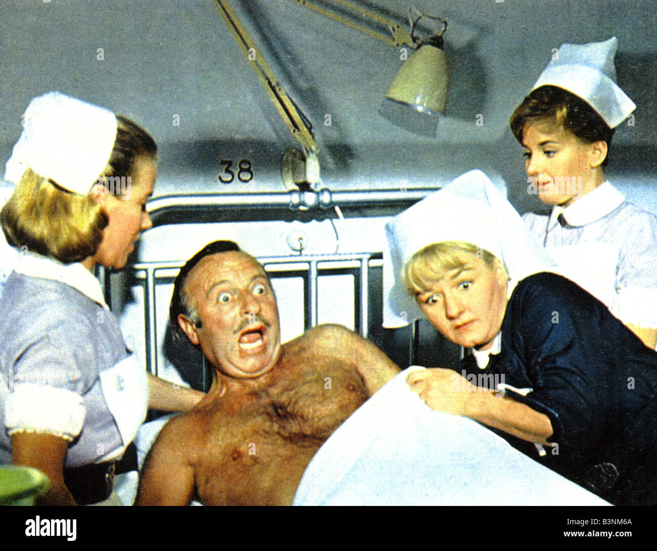 DOCTOR IN CLOVER   1966 Rank Betty Fox film with Leslie Phillips and Joan Sims at right Stock Photo