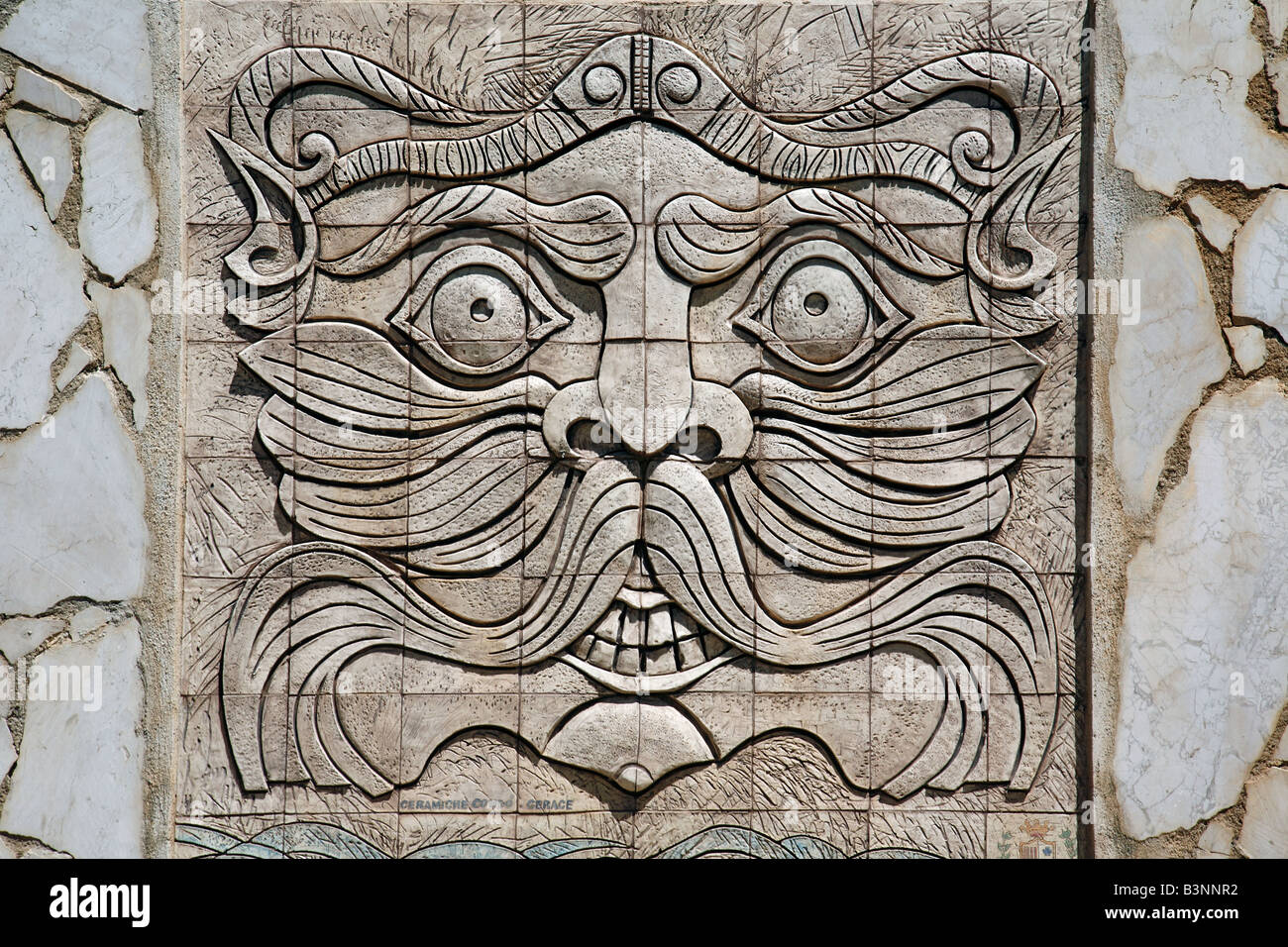 Italy, Calabria, Palmi, Province of Reggio Calabria, Viola Coast, Strait of Messina, Straits of Messina, mask at a wall, relief, grimace, visage, hideous face, snoot, mow, mowe, apotropaically, apotropaic, superstition, superstitiousness, bale, calamity, Stock Photo