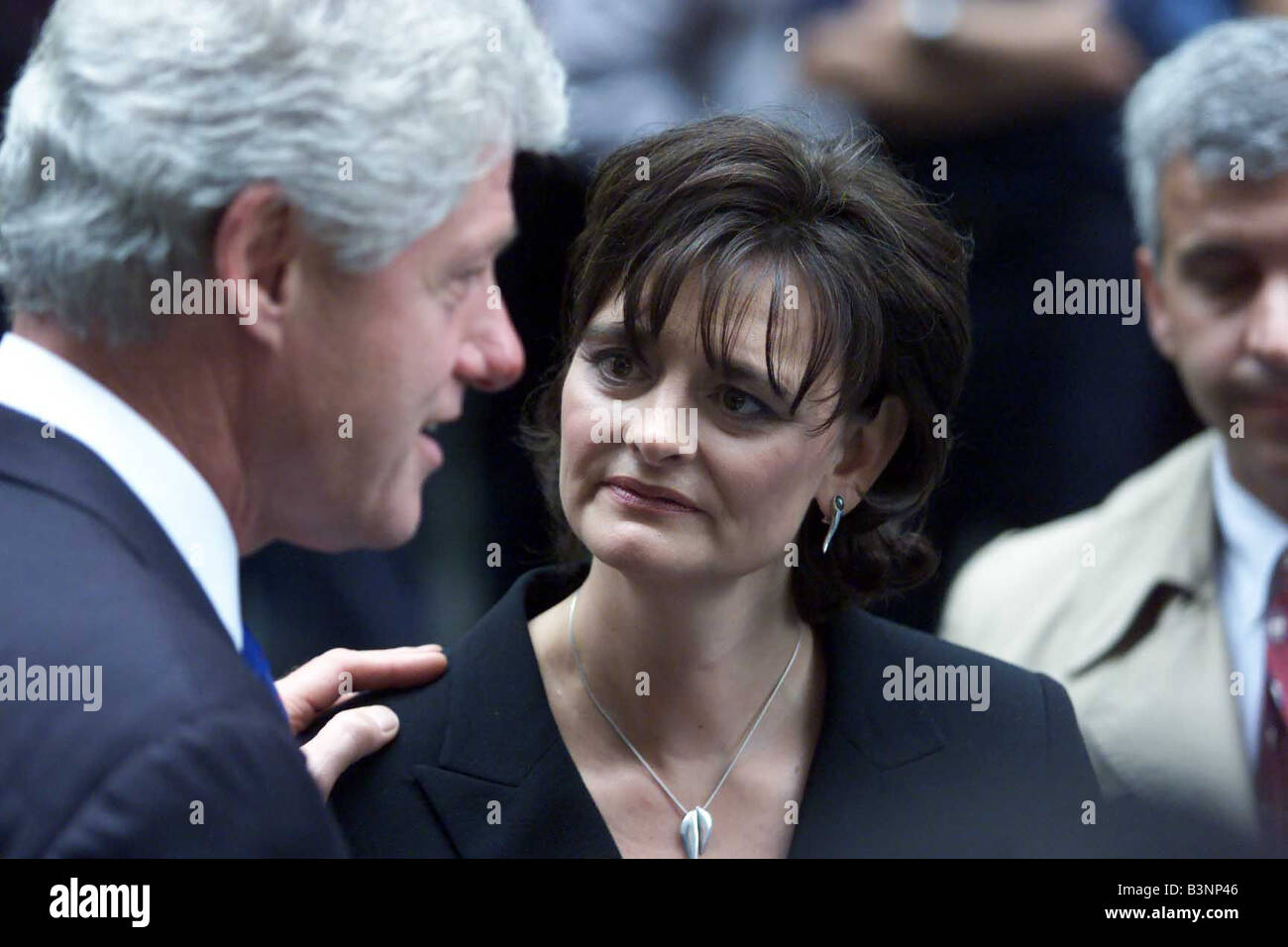 Cherie Blair Sept 2001 wife of British Prime Minister Tony Blair talks with former U S President Bill Clinton at a memorial to fallen fire fighters lost in the World Trade Center attack September 20 2001 outside the Engine company 8 Ladder 2 station in New York Blair met relatives of the ten men lost from the station Stock Photo