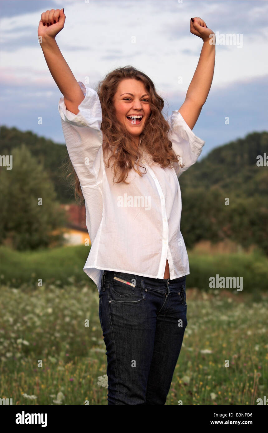 Raised arms woman hi-res stock photography and images - Alamy