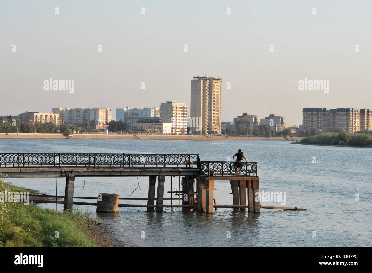Evening view of the City of Atyrau in Western Kazakhstan from the Ural river, the historic boundary between Europe and Asia Stock Photo