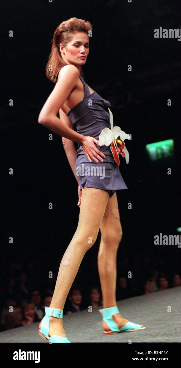 Vivienne Westwood fashion show at Glasgow SECC January 1999 Model wears  short blue dress Stock Photo - Alamy