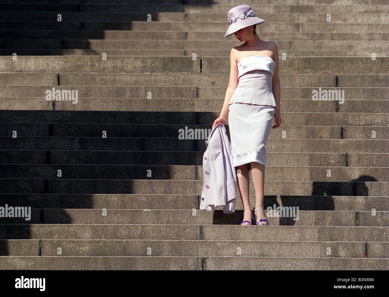 Summer suit fashion May 1999 Model wearing strapless lilac top and skirt by  Karen Millen hat from Debenhams and shoes Stock Photo - Alamy