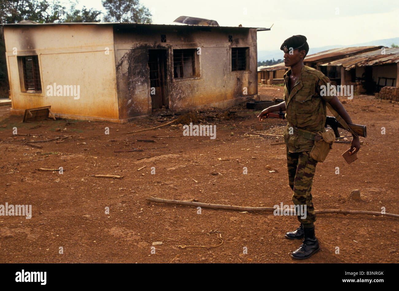Soldier patrolling outside the Kibimba petrol station Stock Photo