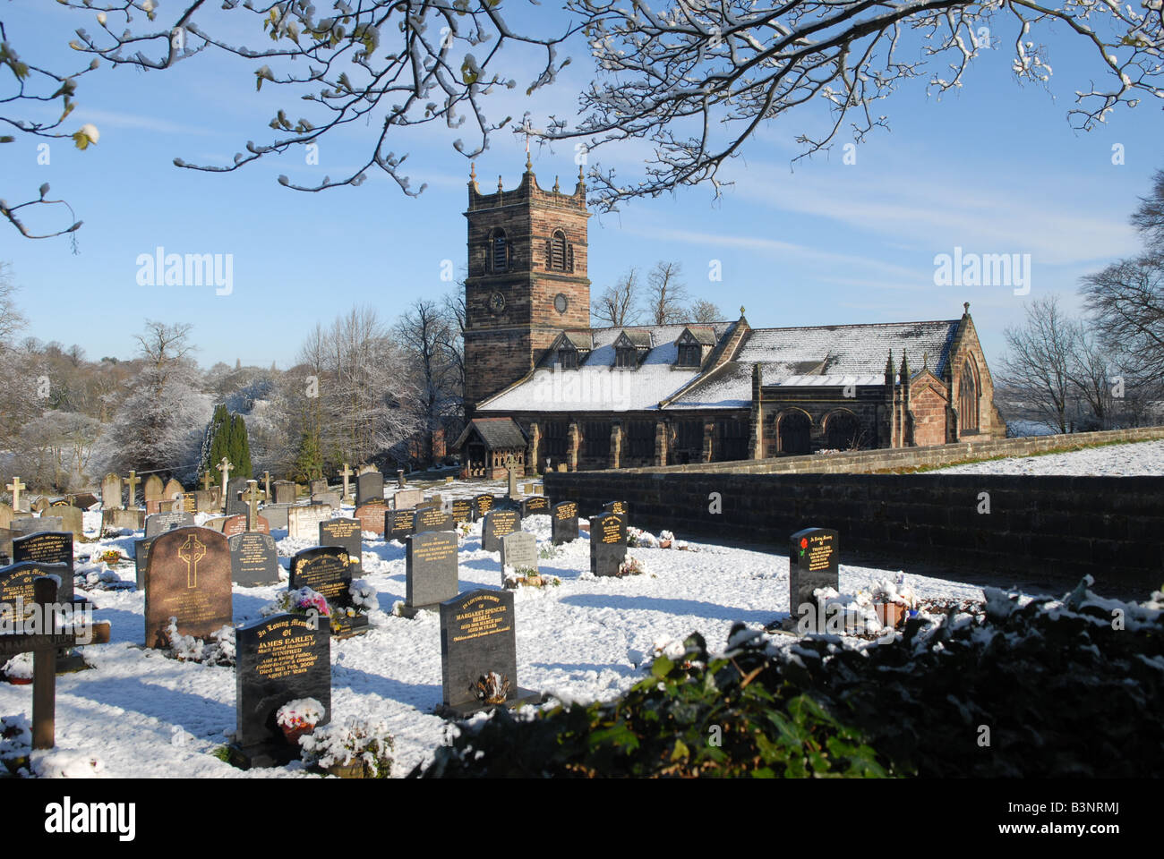 Parish Church of Saint Mary's in Rostherne village near Knutsford, Cheshire on a snowy April morning 2008 Stock Photo