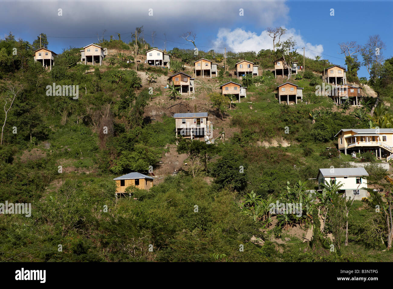 Wooden houses on stilts on hillside in Grenada, West Indies Stock Photo