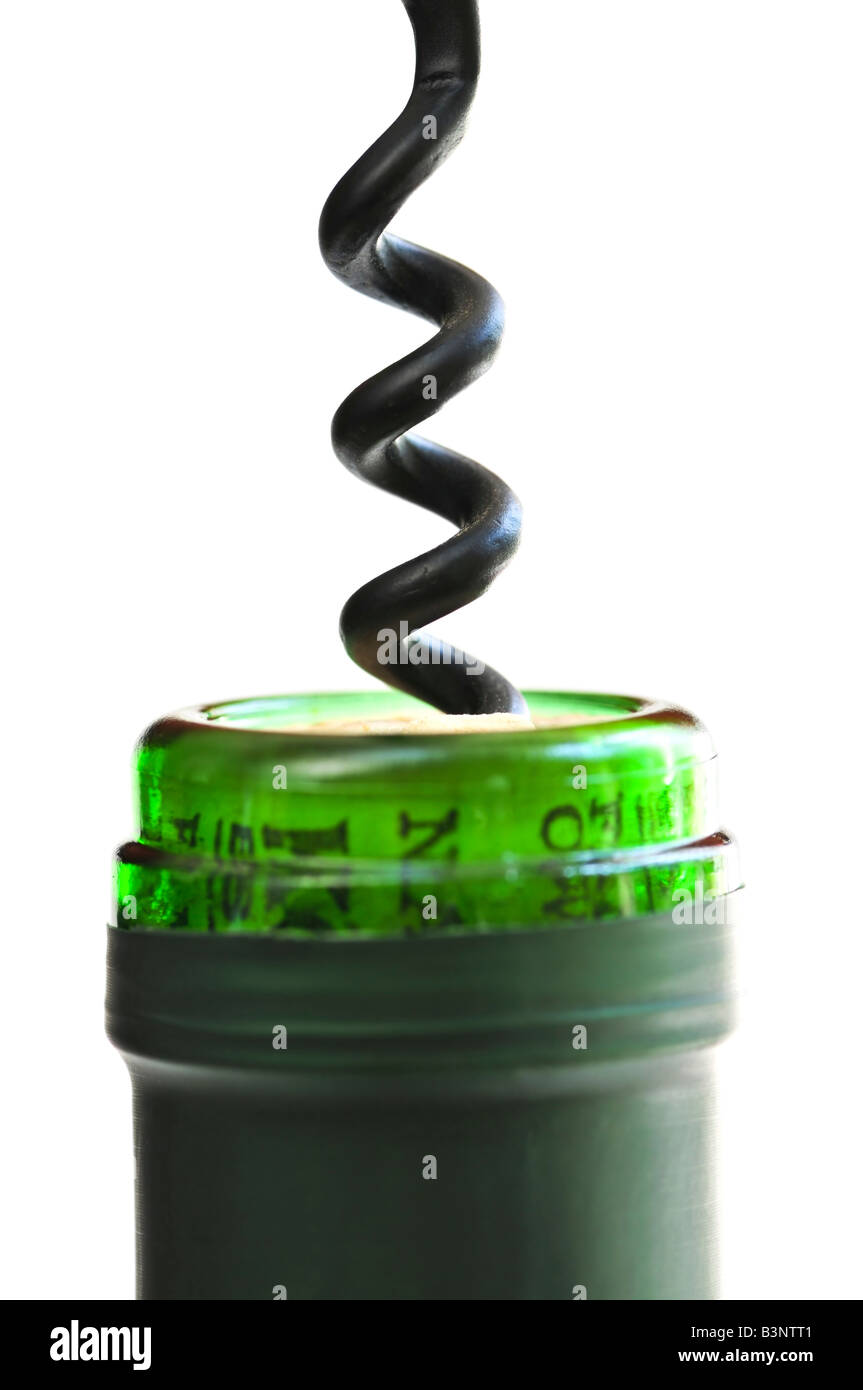 Opening wine bottle with a corkscrew on white background Stock Photo