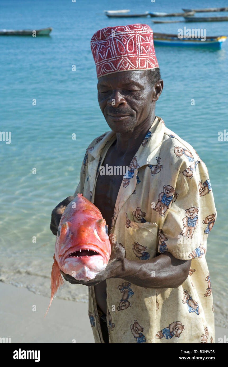 Fisherman holds up a Red Snapper, Lutjanus campechanus, Masoko Bay in Kilwa, Tanzania Stock Photo