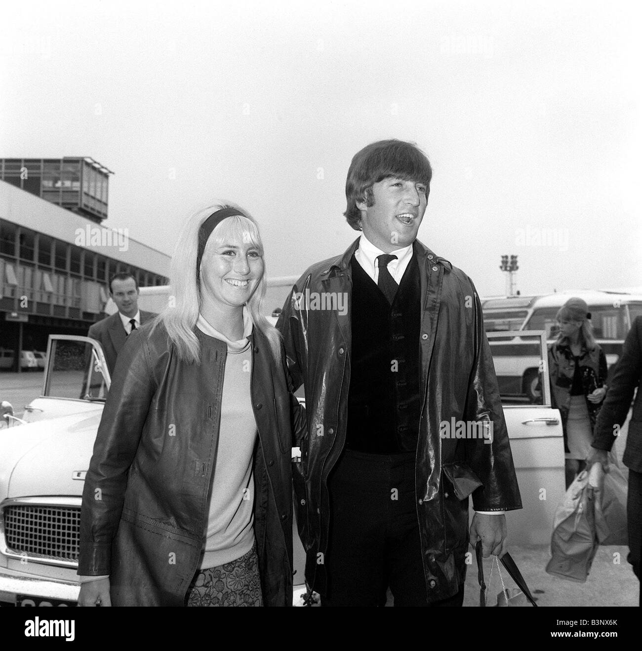The Beatles May 1964 John Lennon with his wife Cynthia walk to the car ...