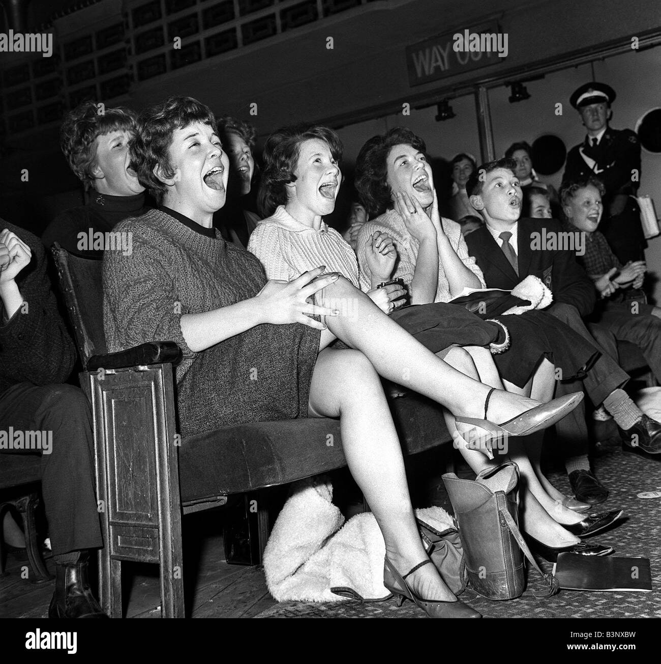 Pop Group The Beatles November 1963 Excited girls screaming for their idols durin the live gig in East Ham Stock Photo