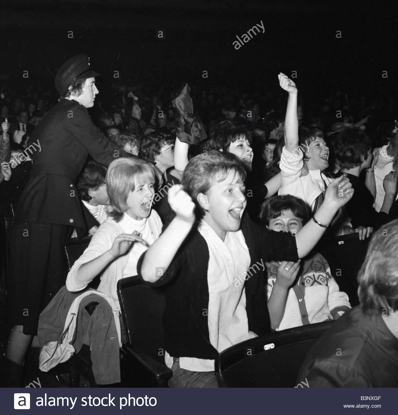 The Beatles November 1963 Fans of The Beatles cheer and scream during ...