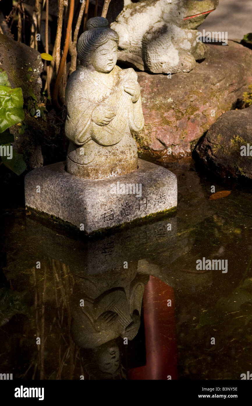 A statue in pond at Kamakura Stock Photo Alamy