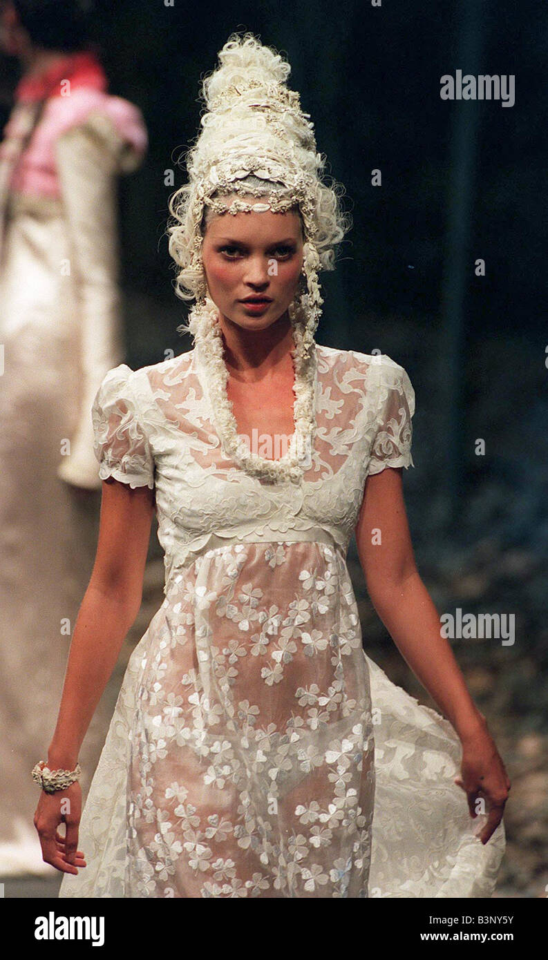 Kate Moss models Givenchy during Paris Fashion Week white Jane Austen style transparent dress and white wig July 1996 Stock Photo