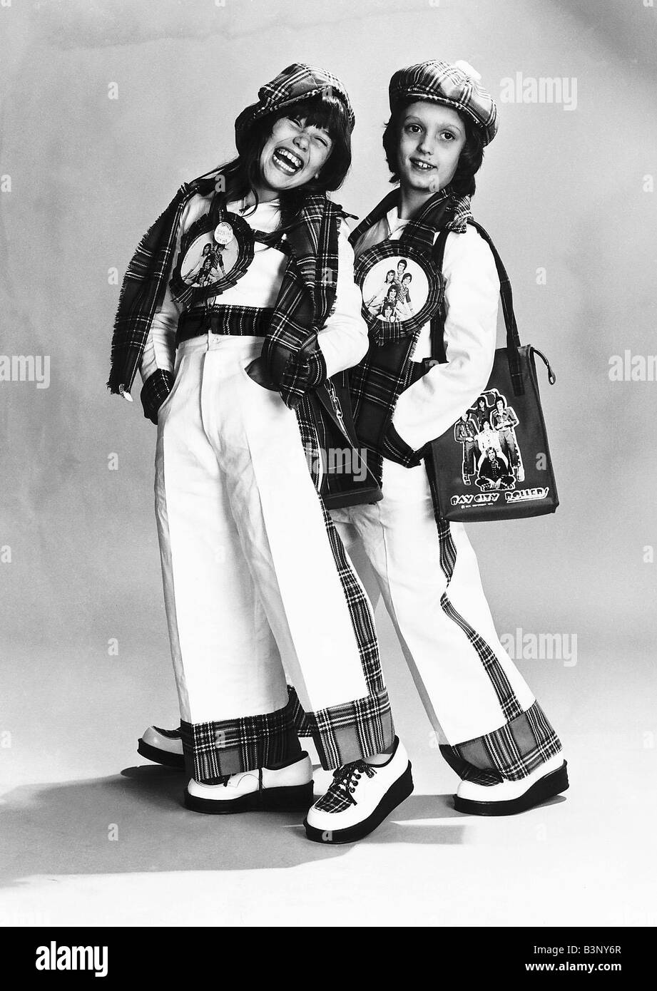 Fashion 1970s The Bay City Rollers clothing range at about 22 Flared  trousers with tartan hats and scarves Stock Photo - Alamy