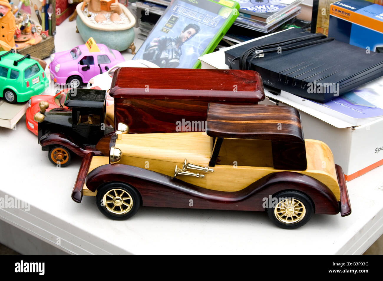 Model of an antique automobile and truck with other items on display Stock Photo