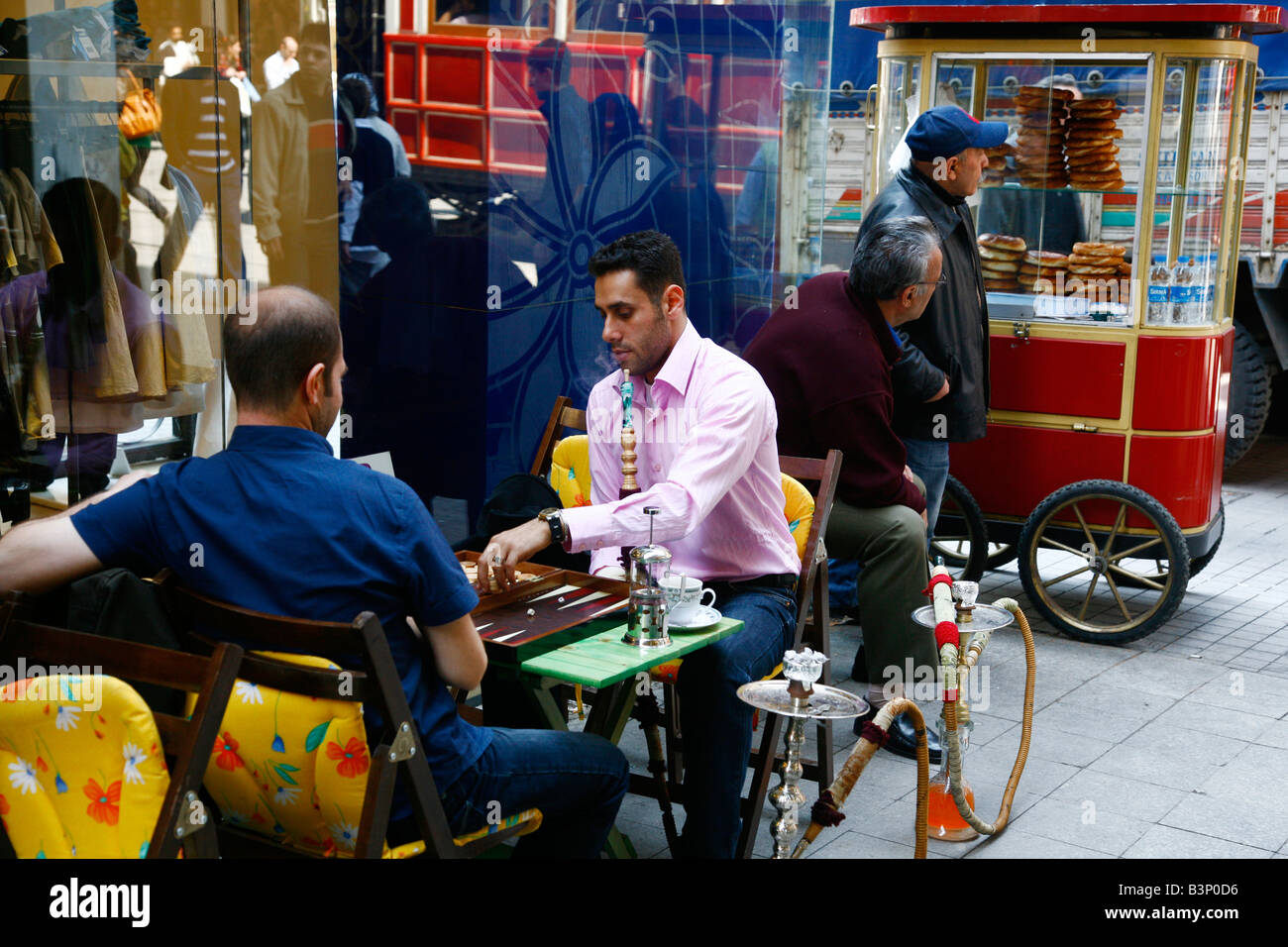 May 2008 - People sitting at a outdoors cafe near Istiklal street Istanbul Turkey Stock Photo