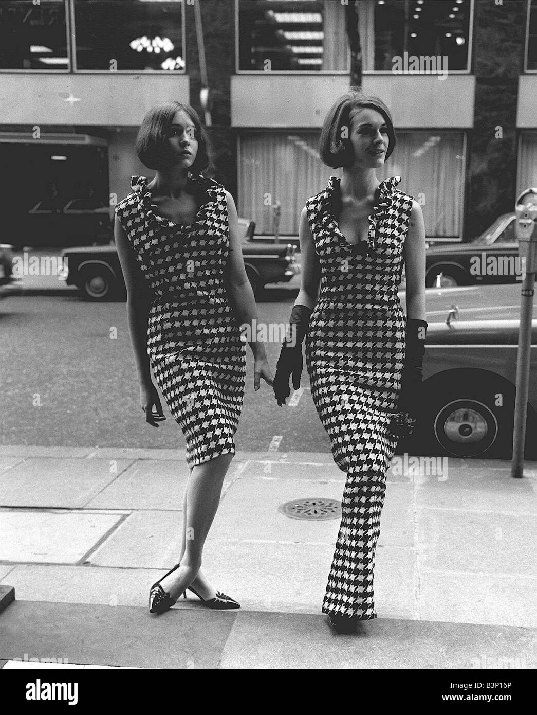 Sixties 60s Fashion by Hershelle at Bruron Street Left Bold black and white Hounds tooth with ruffled collar with Right wearing Stock Photo