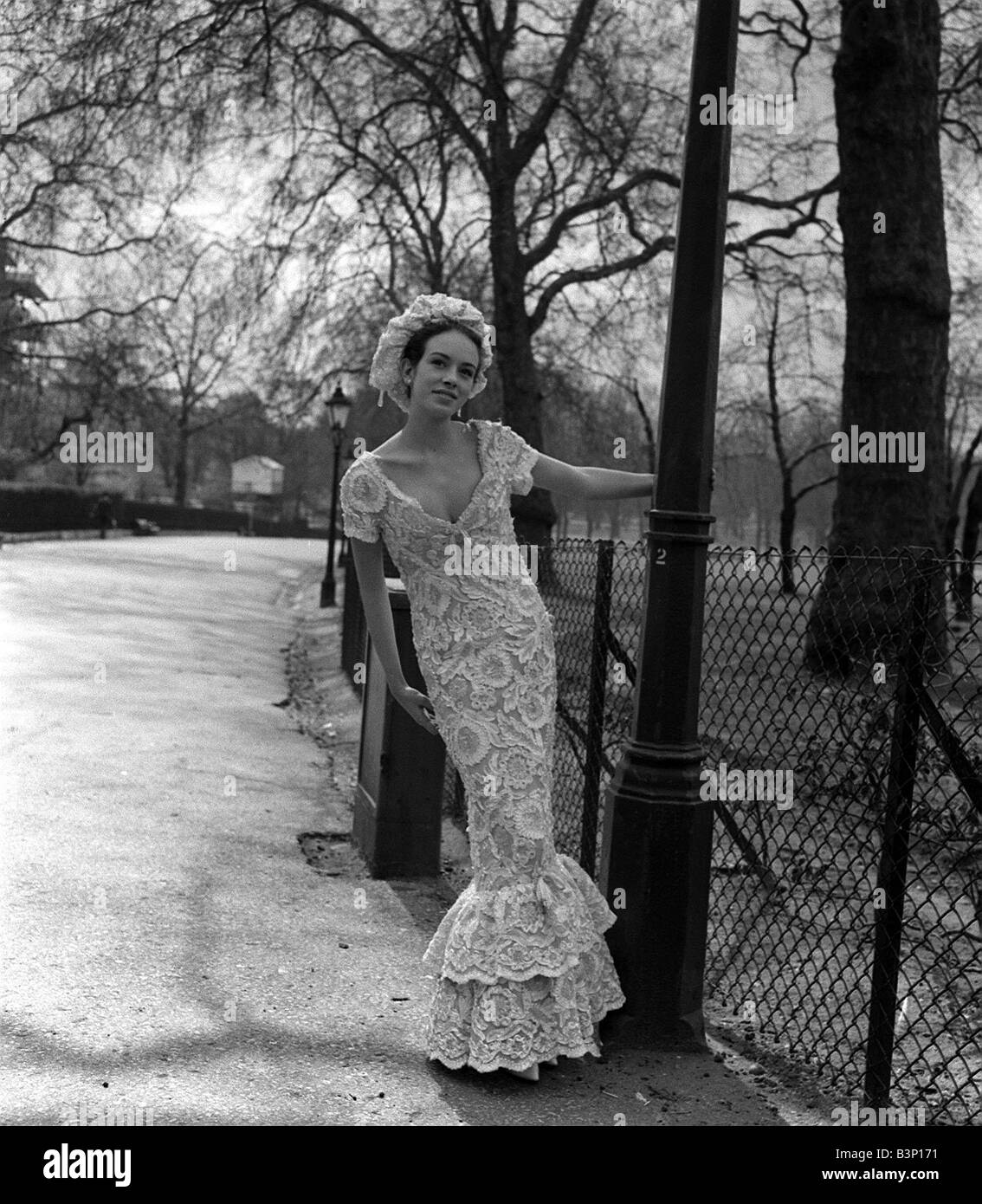 Christian Dior Paris Haute Couture Autumn Winter Model wearing a flolength  charcoal strapless evening dress a sculpted skirt Stock Photo - Alamy